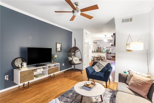3675 Peachtree Rd NE Unit 24, Atlanta, GA 30319 - living area featuring ceiling fan, ornamental molding, and wood finished floors