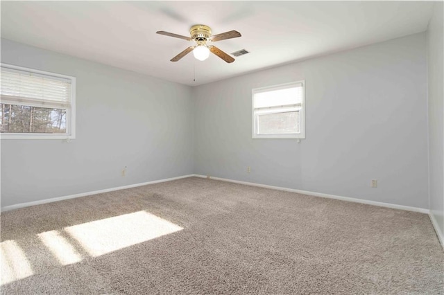 empty room featuring ceiling fan and carpet floors