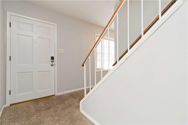 foyer featuring carpet