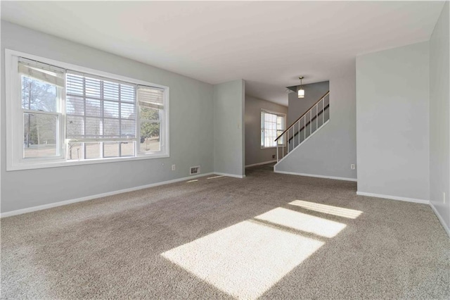 unfurnished room with carpet floors