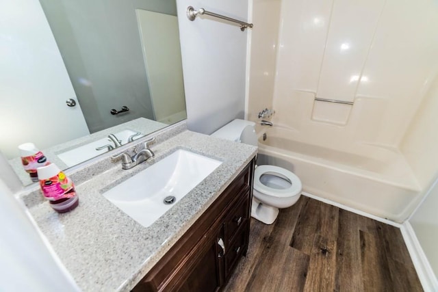 full bathroom with hardwood / wood-style flooring, shower / tub combination, vanity, and toilet