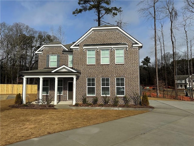 view of front of property featuring a front yard and a porch