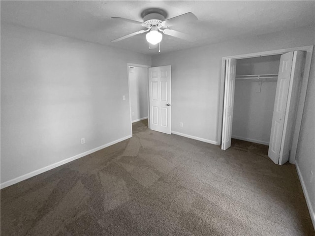 unfurnished bedroom featuring ceiling fan, a closet, dark carpet, and baseboards