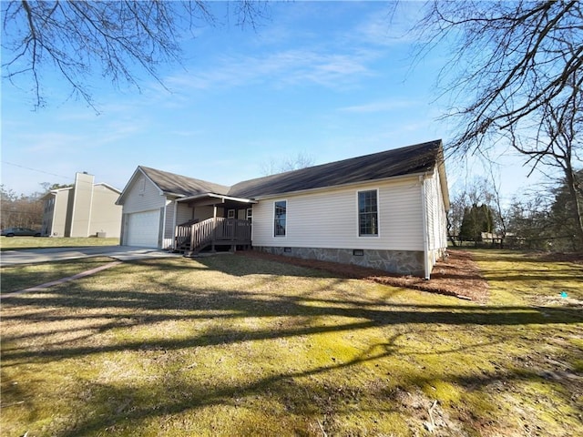 view of front of property featuring a porch, a front yard, crawl space, a garage, and driveway