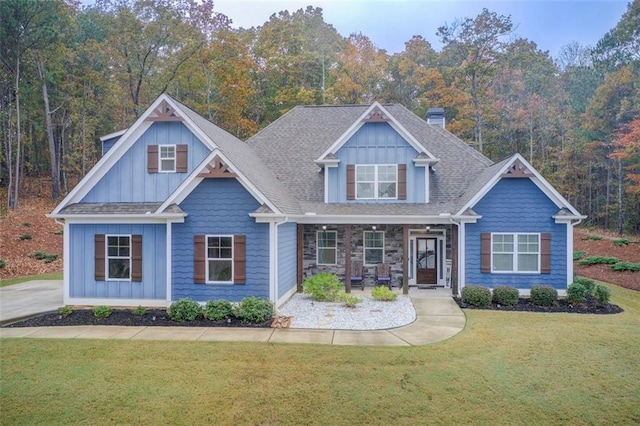 401 Night Hawk Ct, Canton, GA 30114 - craftsman house with a front yard, board and batten siding, and a porch