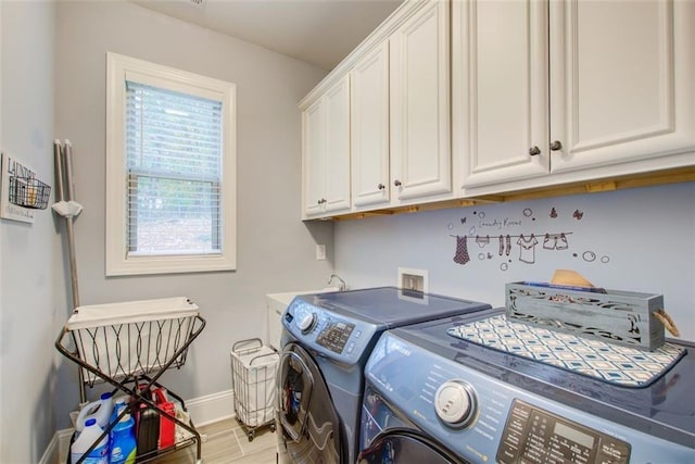 401 Night Hawk Ct, Canton, GA 30114 - laundry area featuring washing machine and dryer, cabinet space, baseboards, and wood finished floors