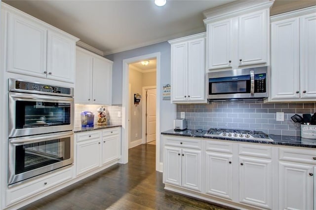 401 Night Hawk Ct, Canton, GA 30114 - kitchen featuring stainless steel appliances, tasteful backsplash, white cabinets, dark stone countertops, and ornamental molding