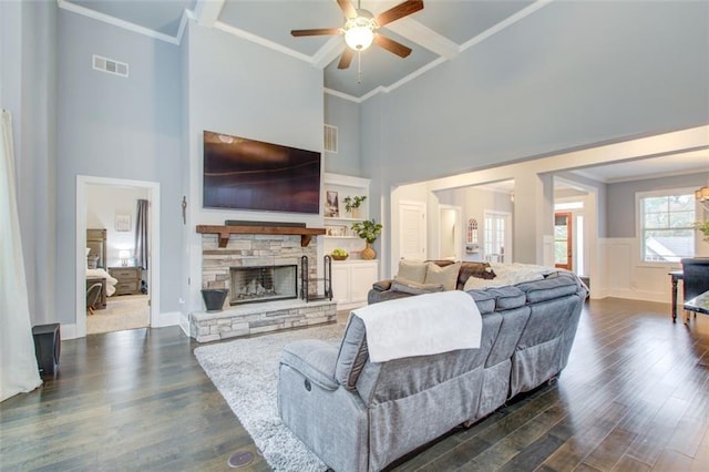401 Night Hawk Ct, Canton, GA 30114 - living room with ceiling fan, a towering ceiling, crown molding, dark wood-style floors, and a fireplace