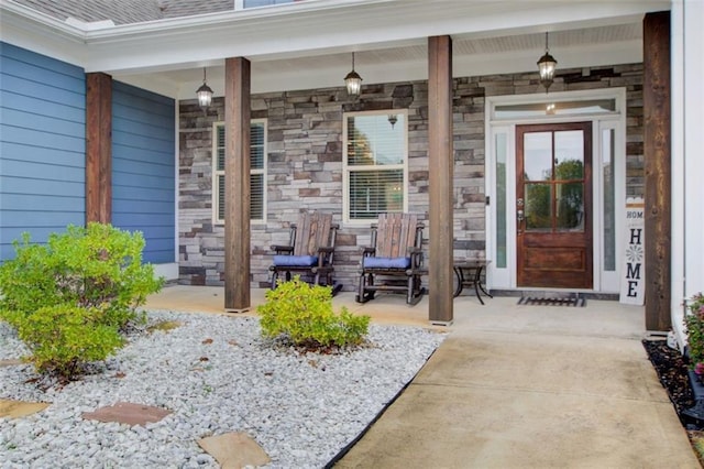 401 Night Hawk Ct, Canton, GA 30114 - view of exterior entry with a porch and stone siding