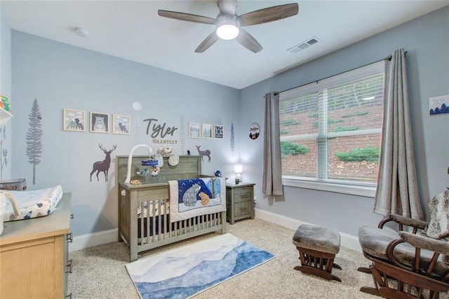 401 Night Hawk Ct, Canton, GA 30114 - carpeted bedroom with baseboards, a crib, and a ceiling fan