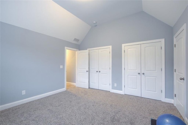 401 Night Hawk Ct, Canton, GA 30114 - unfurnished bedroom with two closets, vaulted ceiling, carpet, and baseboards