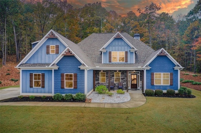 401 Night Hawk Ct, Canton, GA 30114 - view of front of home featuring a lawn, covered porch, board and batten siding, and a chimney