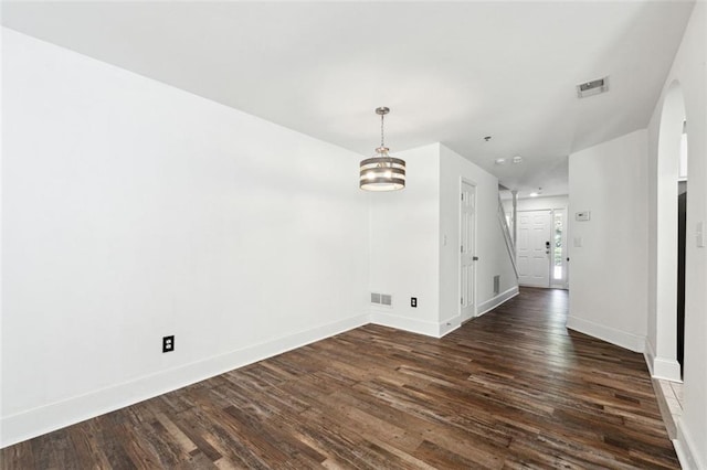 215 Morris Ln, Woodstock, GA 30188 - unfurnished room featuring dark wood-style floors, baseboards, and a chandelier