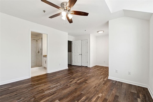 215 Morris Ln, Woodstock, GA 30188 - unfurnished bedroom featuring wood finished floors, baseboards, connected bathroom, and a closet