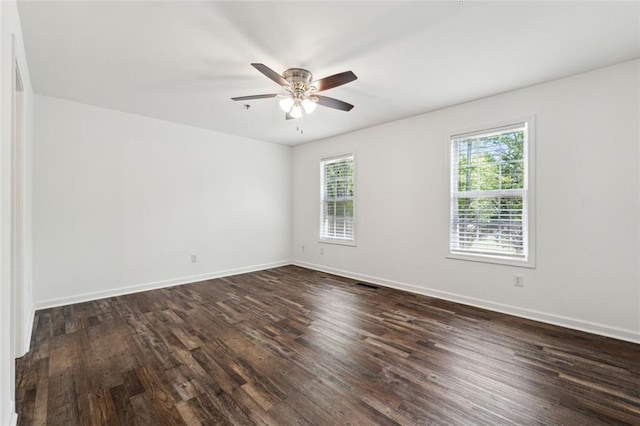 215 Morris Ln, Woodstock, GA 30188 - unfurnished room with dark wood-style floors, ceiling fan, and baseboards