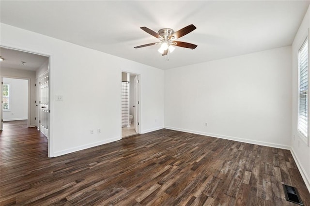 215 Morris Ln, Woodstock, GA 30188 - empty room with dark wood-style flooring, a ceiling fan, and baseboards