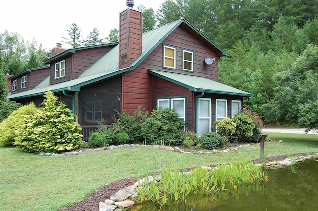 30C River Forest Pl, Suches, GA 30572 - view of front of home featuring a chimney, a front lawn, and a sunroom