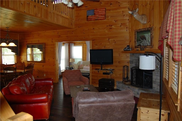 30C River Forest Pl, Suches, GA 30572 - living room with hardwood / wood-style floors, wood walls, ceiling fan, and a stone fireplace