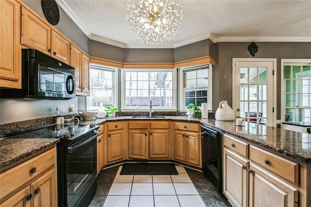 kitchen with dark tile patterned floors, sink, dark stone counters, a textured ceiling, and black appliances