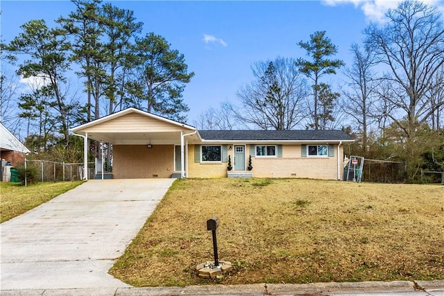 ranch-style home featuring driveway, an attached carport, crawl space, and a front yard