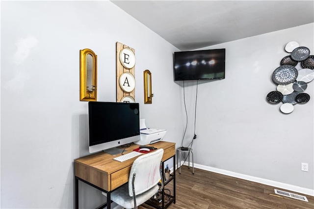 home office featuring dark wood-style floors, baseboards, and visible vents