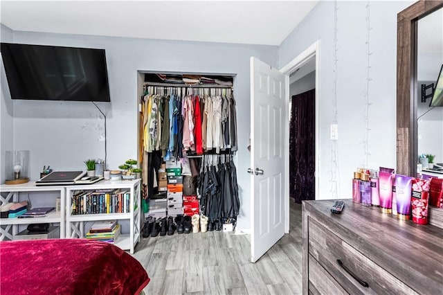 bedroom with a closet and light wood-style floors
