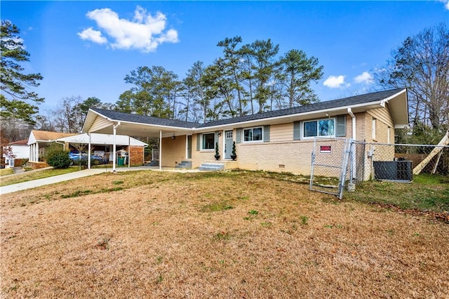single story home featuring brick siding, fence, driveway, crawl space, and a carport