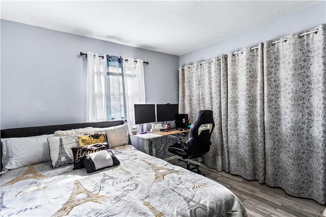 bedroom with wood finished floors