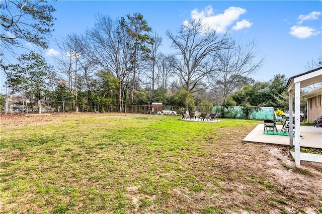 view of yard with a fenced backyard and a patio