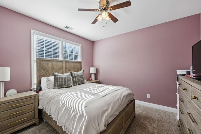 bedroom with ceiling fan and dark colored carpet