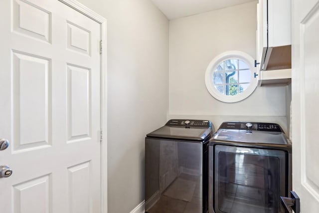 washroom with independent washer and dryer and tile patterned flooring