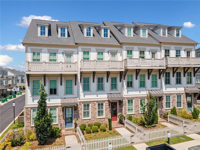 1104 Thomas St, Woodstock, GA 30188 - townhome / multi-family property featuring a residential view, a shingled roof, and brick siding