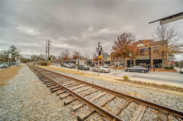 1104 Thomas St, Woodstock, GA 30188 - view of asphalt road featuring traffic signs and street lights