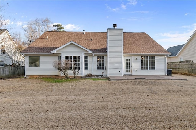 back of property featuring a yard and a patio area