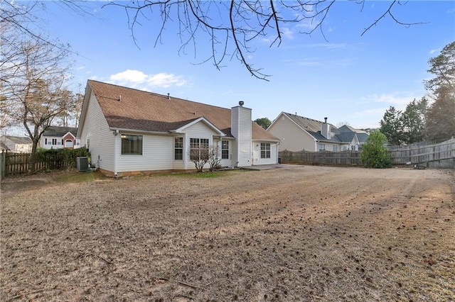 rear view of house featuring cooling unit