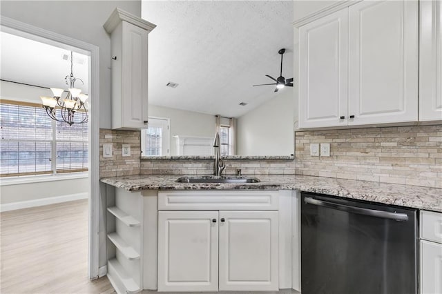 kitchen featuring white cabinetry, dishwasher, light stone countertops, and sink