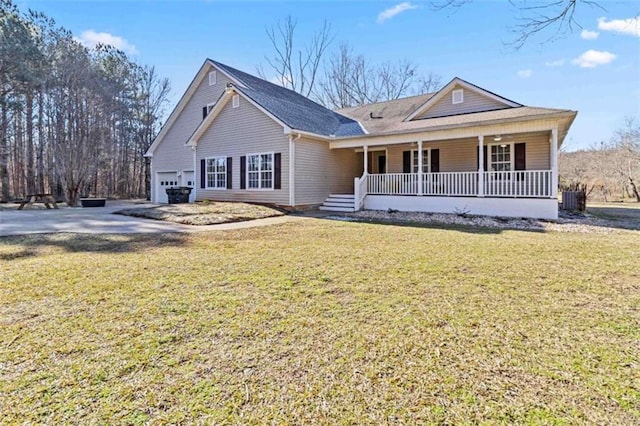 view of front facade featuring covered porch, a front lawn, and a garage