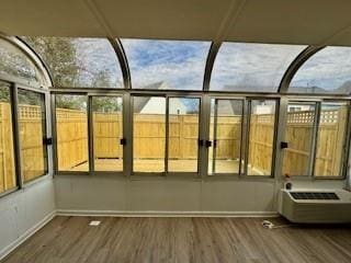 unfurnished sunroom with a healthy amount of sunlight