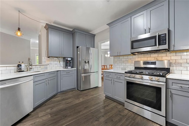 2994 Meadow Church Rd, Suwanee, GA 30024 - kitchen with stainless steel appliances, gray cabinets, a sink, ornamental molding, and decorative backsplash