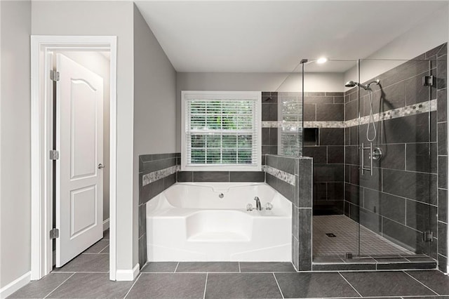 2994 Meadow Church Rd, Suwanee, GA 30024 - bathroom with a bath, tile patterned flooring, a shower stall, and baseboards
