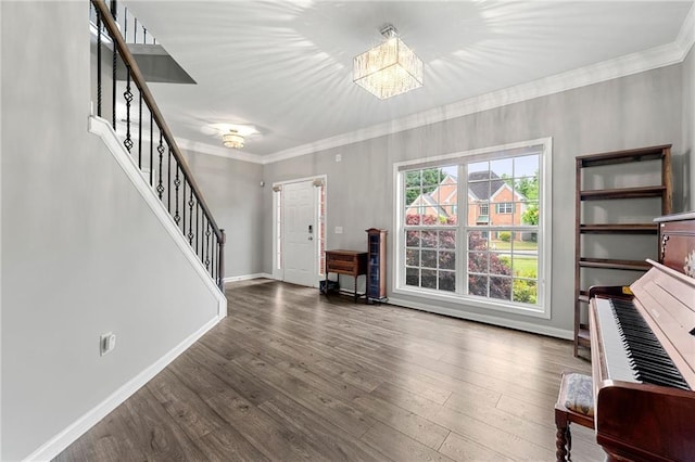 2994 Meadow Church Rd, Suwanee, GA 30024 - foyer with crown molding, stairway, wood finished floors, a chandelier, and baseboards