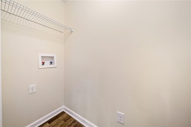 laundry room with hookup for a washing machine and hardwood / wood-style flooring