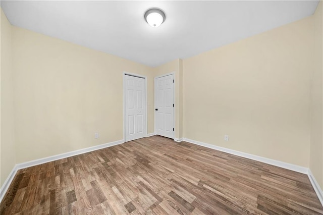 spare room featuring hardwood / wood-style floors