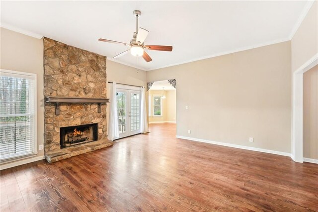 105 Spring Forest Way, Sharpsburg, GA 30277 - unfurnished living room featuring ornamental molding, ceiling fan, baseboards, and wood finished floors