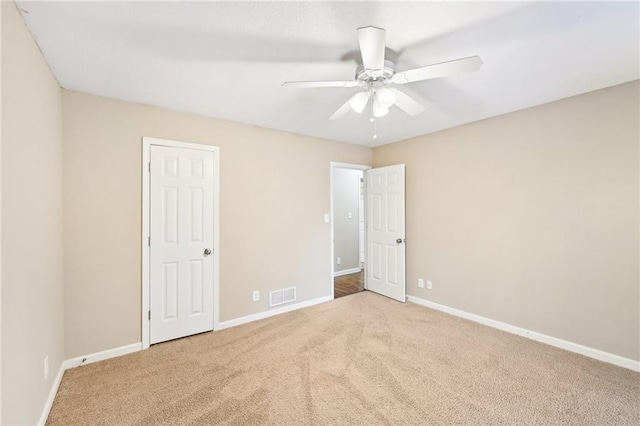 105 Spring Forest Way, Sharpsburg, GA 30277 - unfurnished bedroom featuring a ceiling fan, baseboards, visible vents, and carpet flooring