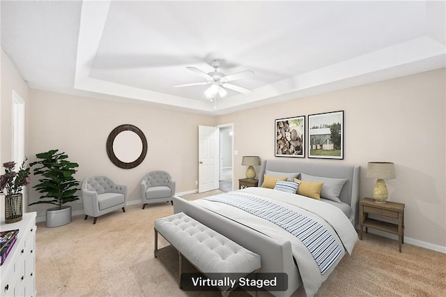 105 Spring Forest Way, Sharpsburg, GA 30277 - bedroom featuring a ceiling fan, a tray ceiling, light carpet, and baseboards