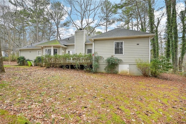 105 Spring Forest Way, Sharpsburg, GA 30277 - back of house featuring a chimney and a wooden deck