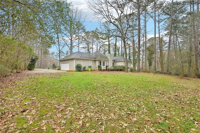 105 Spring Forest Way, Sharpsburg, GA 30277 - view of yard featuring an attached garage