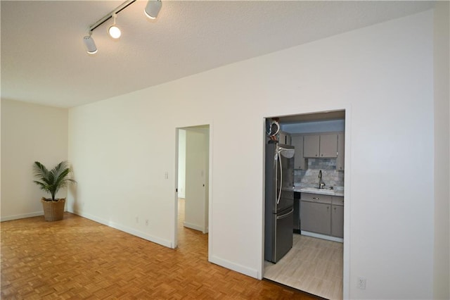 interior space featuring light parquet flooring and sink