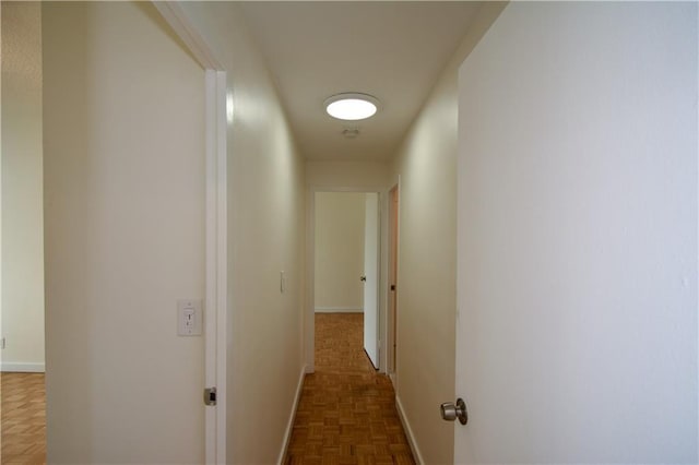 hallway with dark parquet floors